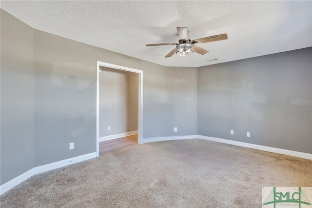 469 Nashview Trl, Allenhurst, GA 31301 - unfurnished room with carpet, visible vents, a ceiling fan, a textured ceiling, and baseboards