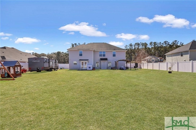 469 Nashview Trl, Allenhurst, GA 31301 - back of property with a lawn, a playground, fence, and a residential view