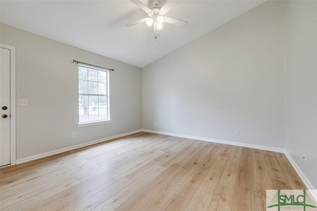 unfurnished room with light wood-type flooring, ceiling fan, lofted ceiling, and baseboards