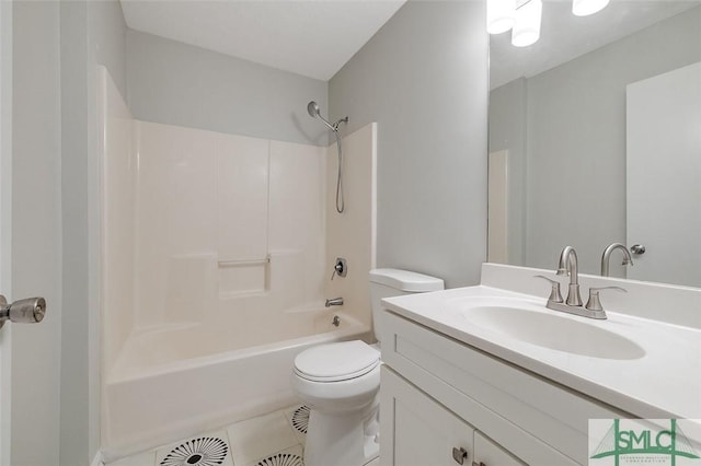 full bath featuring toilet, tile patterned floors, vanity, and shower / bathing tub combination