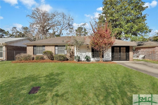 ranch-style home with concrete driveway, brick siding, a front yard, and fence