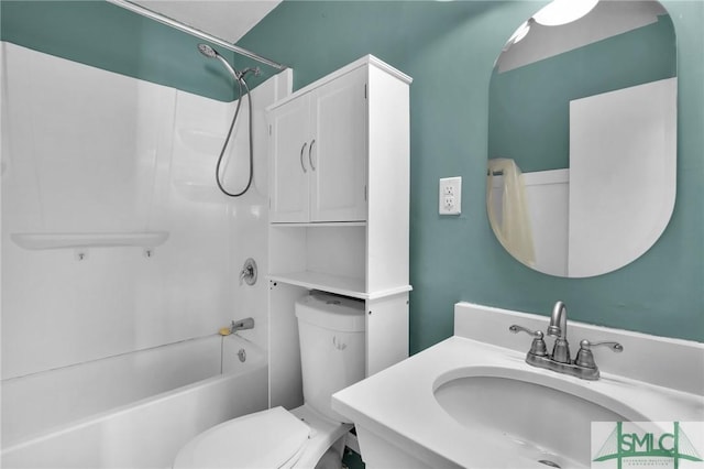 full bathroom featuring  shower combination, toilet, and a sink