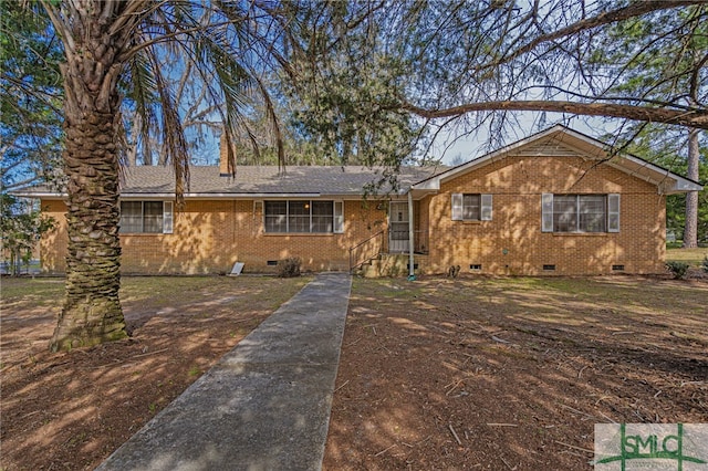 ranch-style house featuring crawl space and brick siding