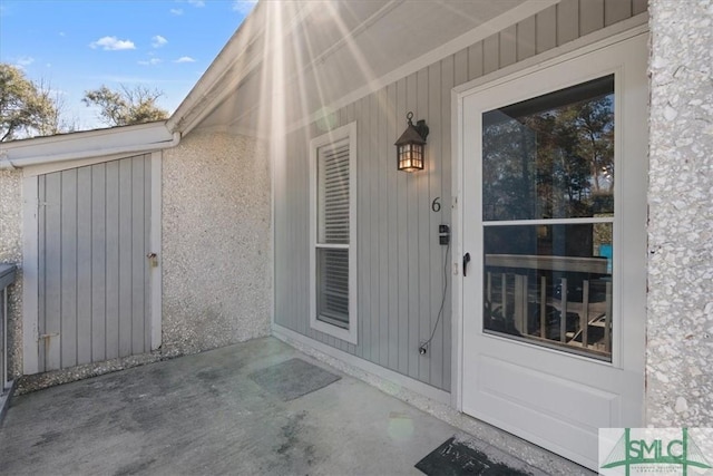 property entrance with a patio area