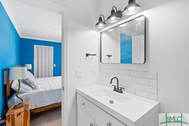 bathroom with ensuite bathroom, ornamental molding, backsplash, and vanity