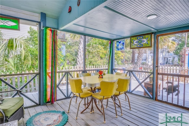 sunroom / solarium with lofted ceiling