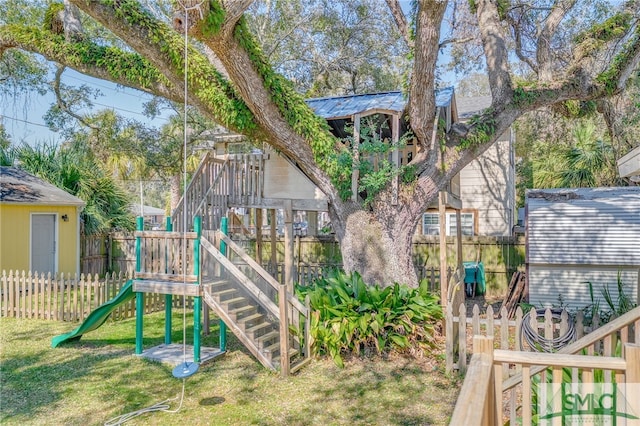 view of play area with a yard and fence