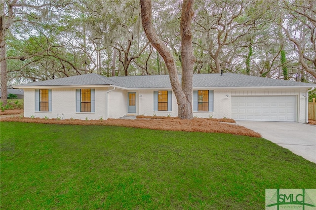 ranch-style home with a garage, brick siding, a shingled roof, concrete driveway, and a front yard