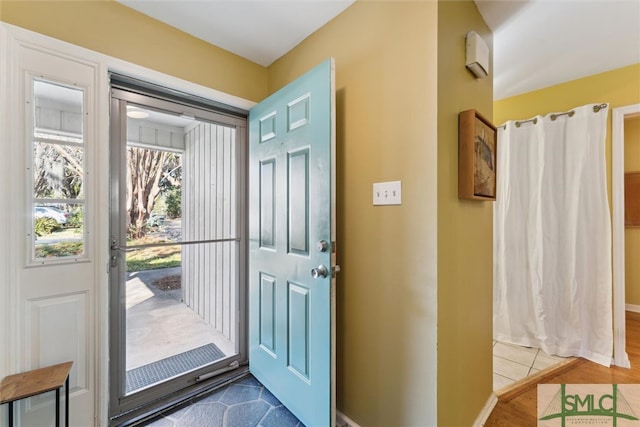 foyer entrance with baseboards