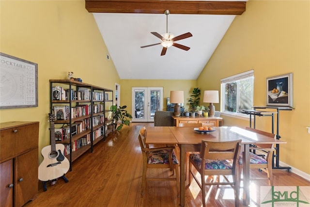 dining room featuring baseboards, wood finished floors, french doors, high vaulted ceiling, and beam ceiling