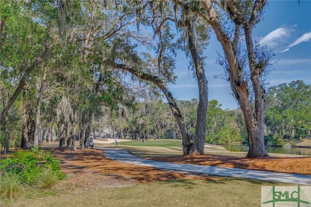 surrounding community with a wooded view