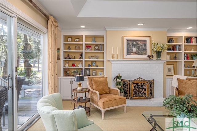 living area featuring ornamental molding, recessed lighting, and a brick fireplace