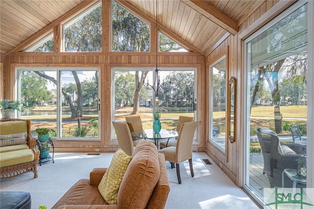 sunroom / solarium featuring a chandelier, lofted ceiling, wood ceiling, and visible vents