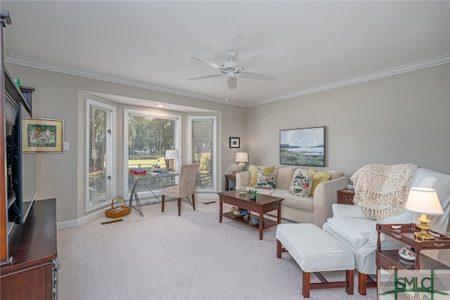 living room featuring ornamental molding, carpet flooring, baseboards, and a ceiling fan