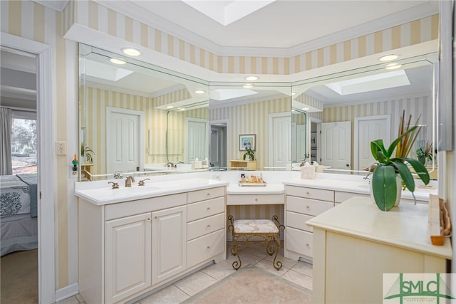 ensuite bathroom with a skylight, ensuite bathroom, and wallpapered walls