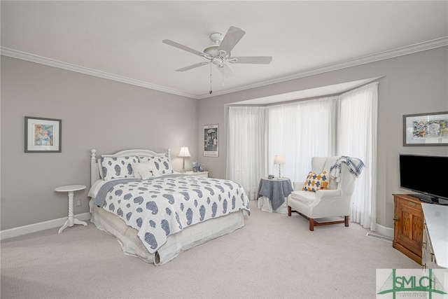 bedroom featuring light carpet, baseboards, ornamental molding, and ceiling fan