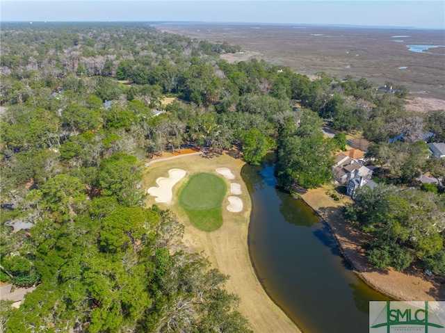 aerial view with a water view and a forest view