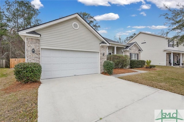 ranch-style house featuring driveway, an attached garage, fence, and a front lawn