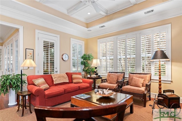 living area featuring visible vents, coffered ceiling, a ceiling fan, and ornamental molding