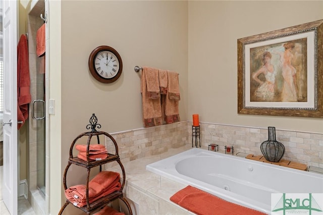 full bath featuring a stall shower and a garden tub