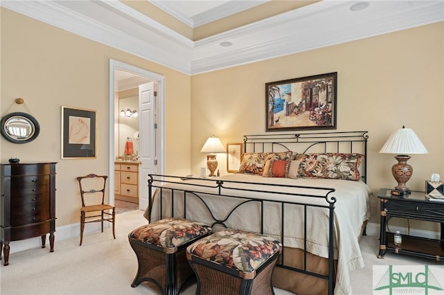 carpeted bedroom featuring ensuite bath, baseboards, and ornamental molding