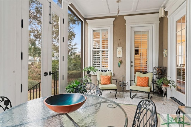 sunroom / solarium featuring a wealth of natural light and french doors