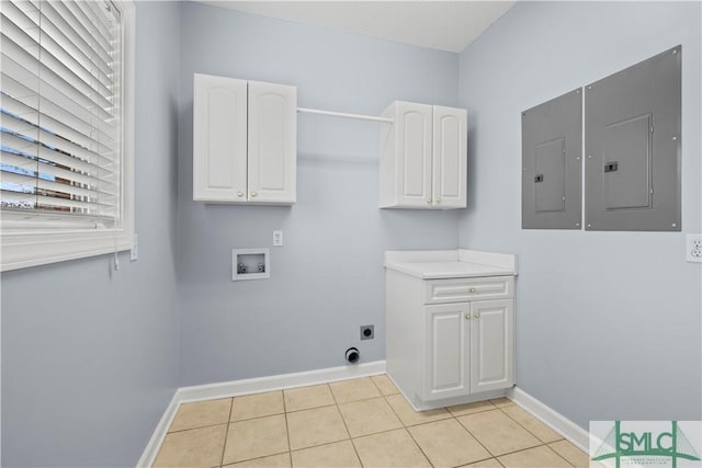 laundry room featuring hookup for a washing machine, electric panel, baseboards, and light tile patterned floors