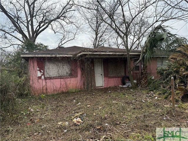 view of front of home featuring roof with shingles