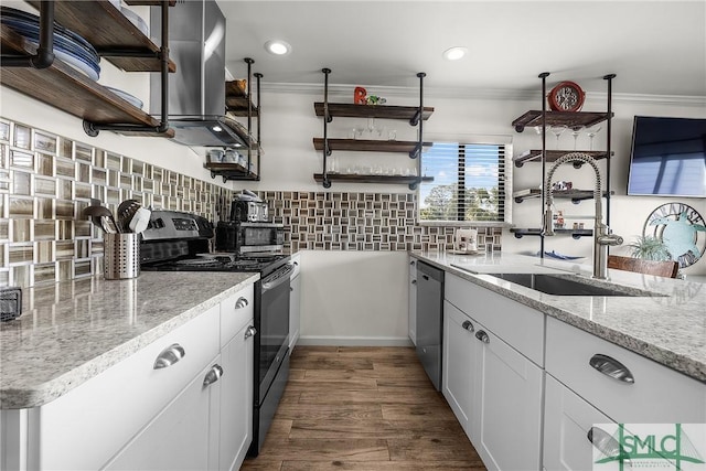 kitchen featuring a sink, stainless steel appliances, open shelves, and white cabinetry