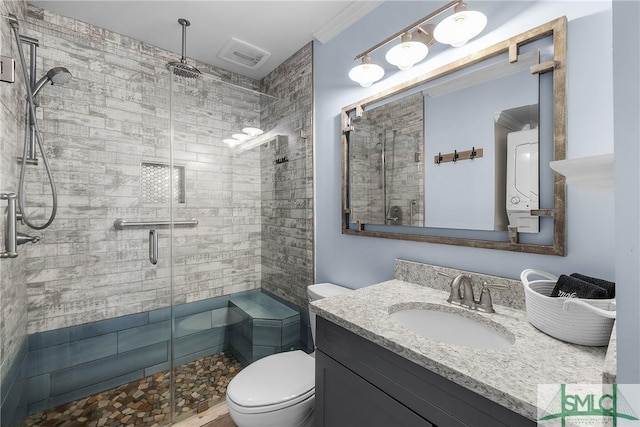 full bath featuring a stall shower, visible vents, vanity, and toilet