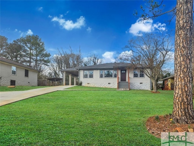 ranch-style home featuring driveway, an attached carport, crawl space, and a front lawn