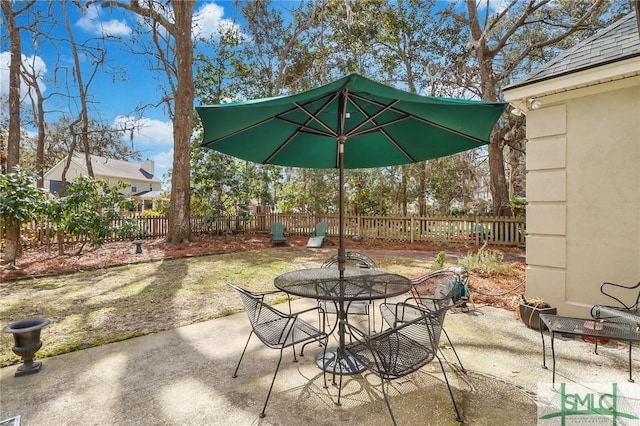 view of patio / terrace with outdoor dining space and a fenced backyard