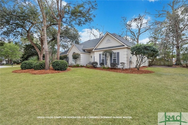 view of front of property with fence and a front yard