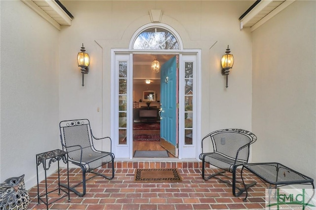 entrance to property with stucco siding