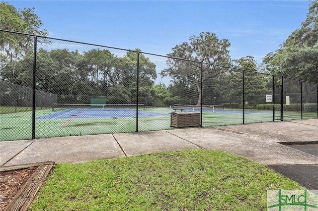 view of tennis court with fence