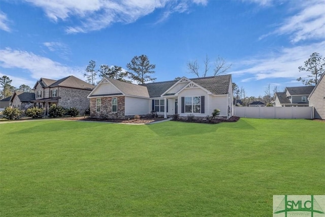 view of front of property featuring a front yard and fence