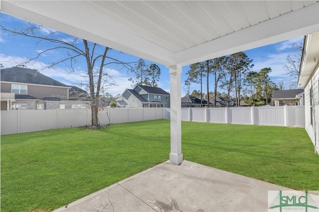 view of yard featuring a patio area and a fenced backyard