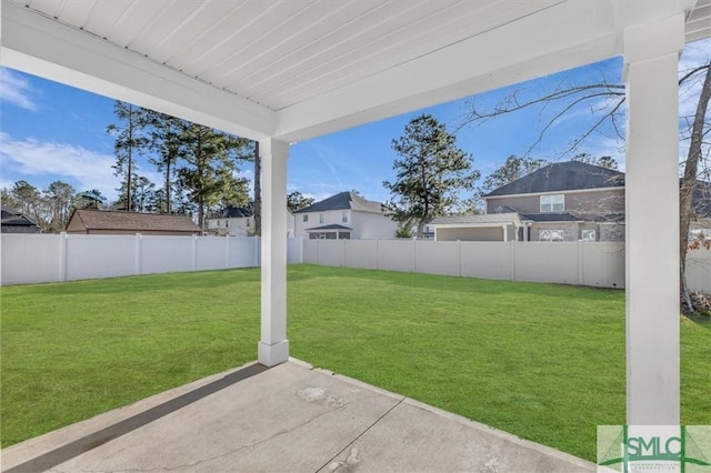 view of yard featuring a patio area and a fenced backyard