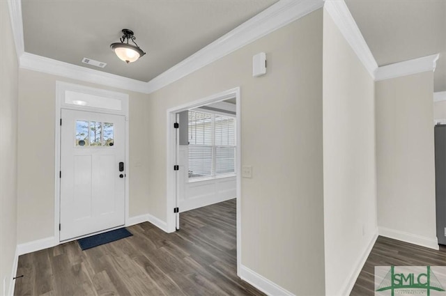 foyer featuring baseboards, dark wood finished floors, and crown molding