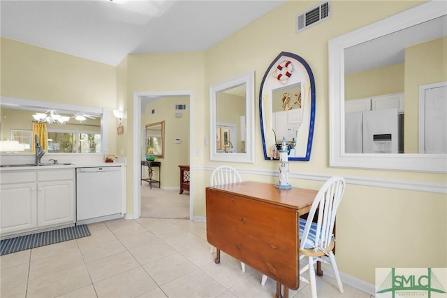 dining room with baseboards, visible vents, and light tile patterned flooring