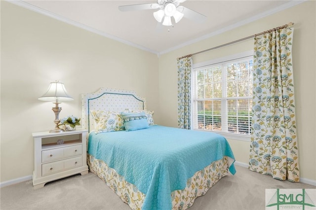 bedroom featuring baseboards, ornamental molding, ceiling fan, and light colored carpet