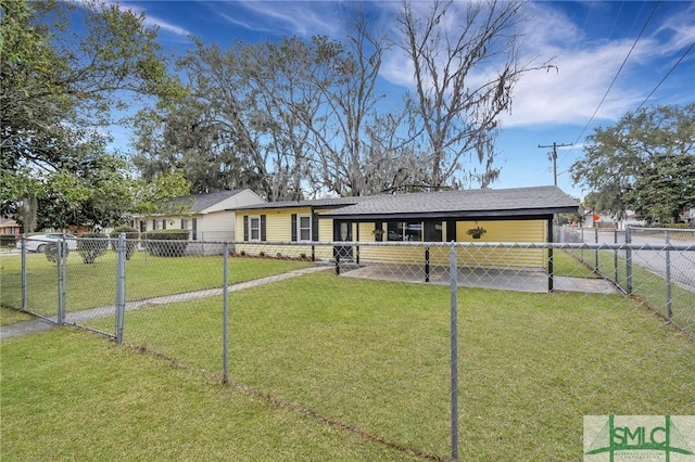 view of front of home with a front yard and fence