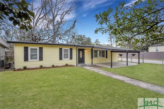 ranch-style home with cooling unit, fence, and a front lawn