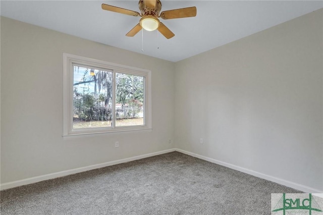 empty room featuring carpet, a ceiling fan, and baseboards