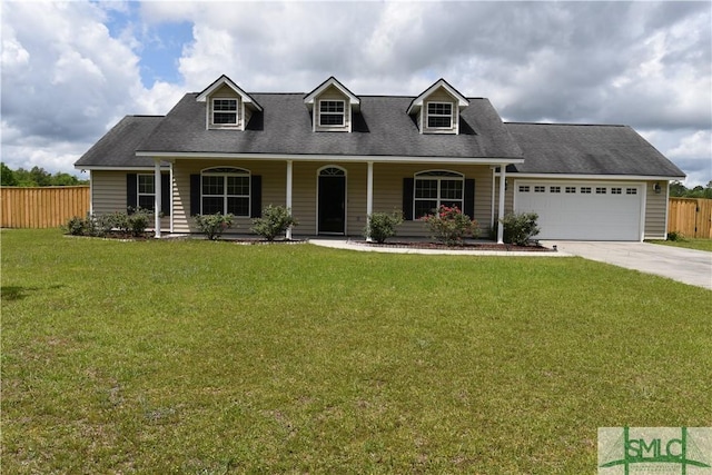 cape cod house with a garage, driveway, a front yard, and fence