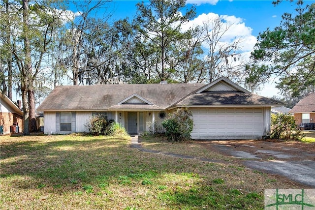 ranch-style home with an attached garage, driveway, and a front lawn