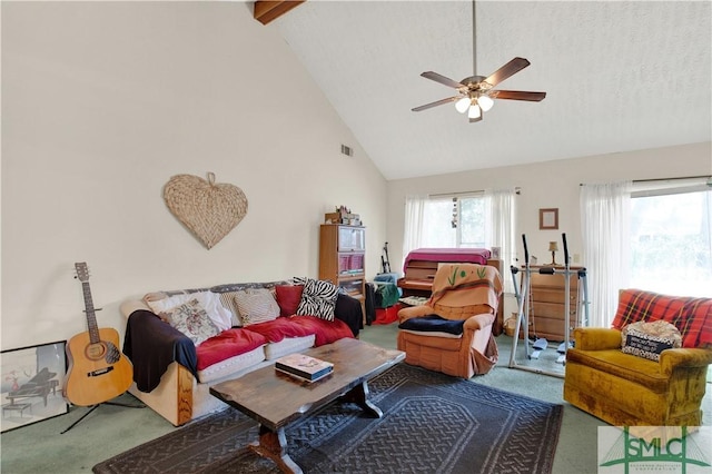 living area featuring visible vents, a ceiling fan, a textured ceiling, carpet flooring, and high vaulted ceiling