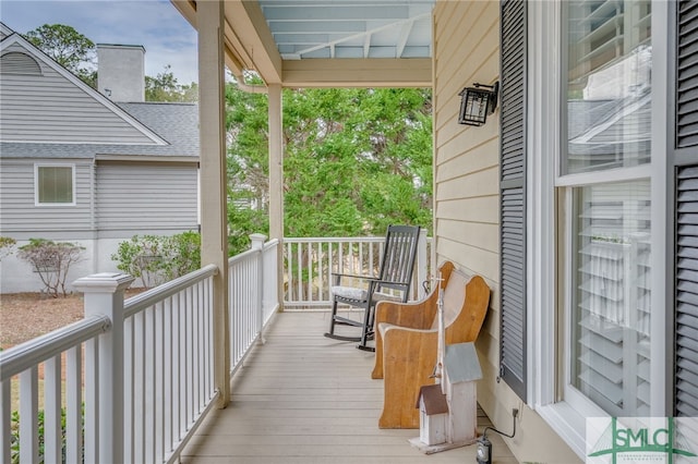 wooden terrace with a porch