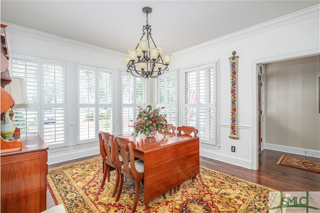 dining space featuring dark wood-style floors, a wealth of natural light, and crown molding