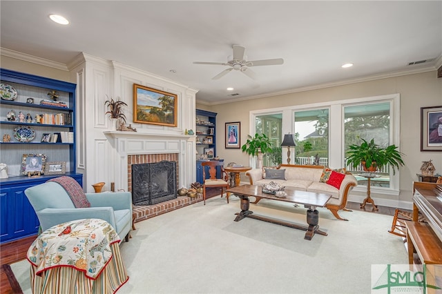 living room with recessed lighting, a brick fireplace, a ceiling fan, and crown molding